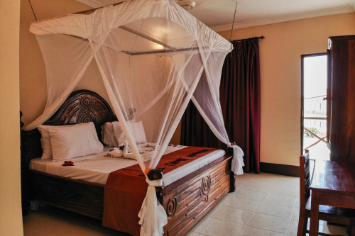 amaan beach bungalows kamer.png