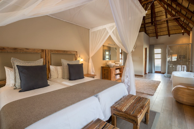 Arathusa Safari Lodge water_facing_room_bedroom6.webp